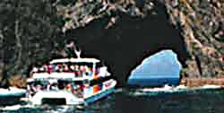 Cruise ship heading for rock tunnel