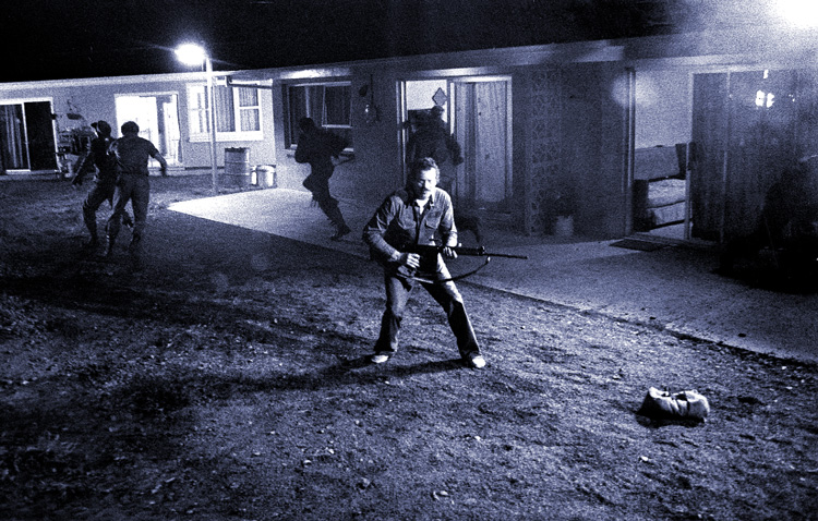 Warren Oates in motel yard